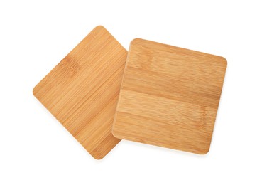 Photo of Wooden cup coasters on white background, top view