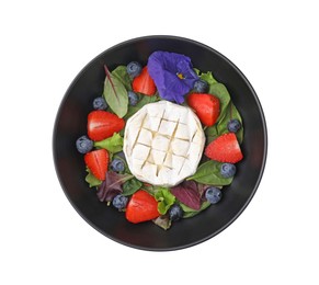 Bowl of delicious salad with brie cheese, blueberries and strawberries isolated on white, top view