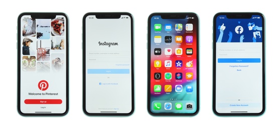 MYKOLAIV, UKRAINE - JULY 07, 2020: New modern iPhone 11 with Facebook, Instagram, Pinterest apps and home screen against white background