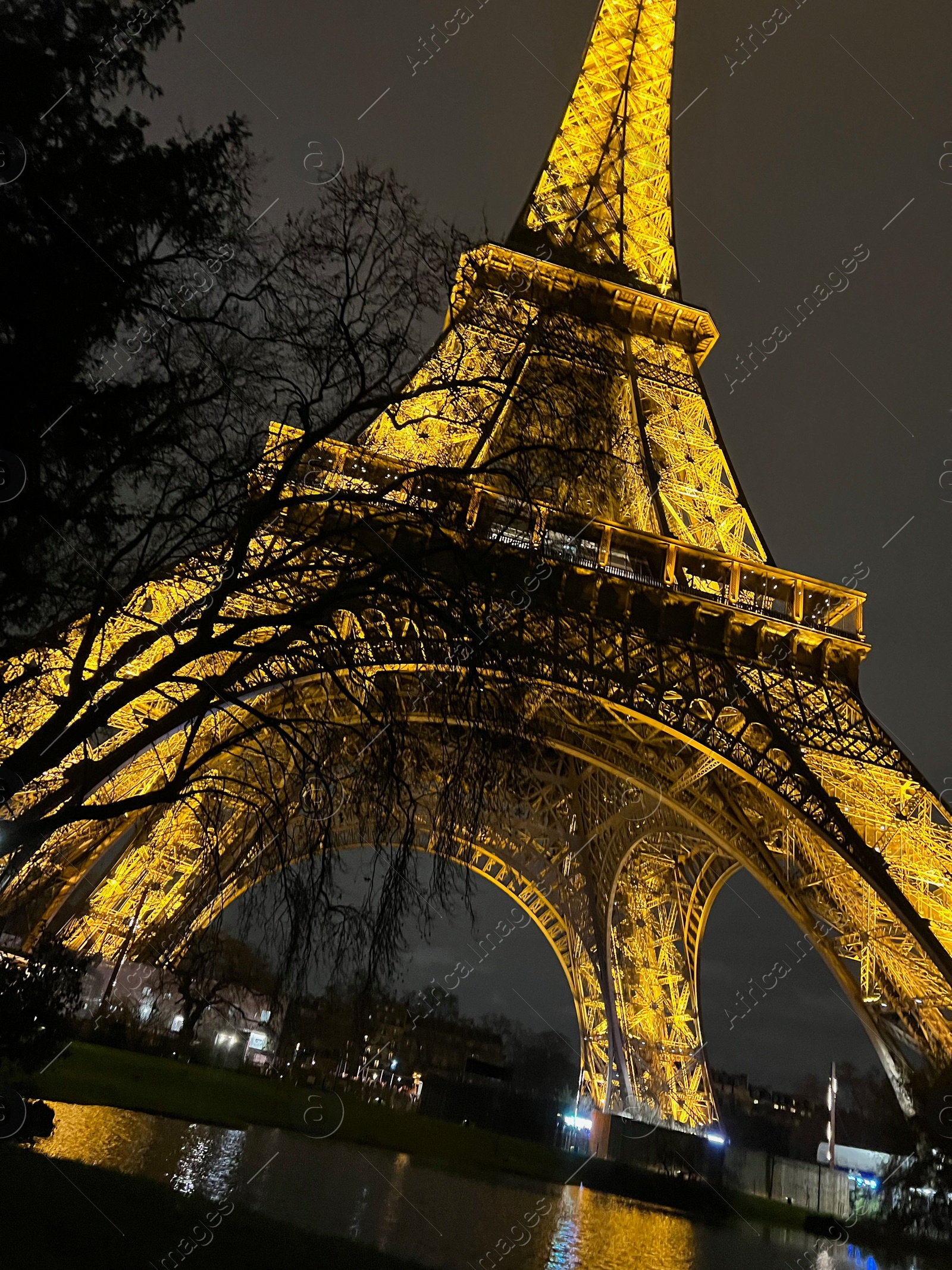 Photo of Beautiful illuminated Eiffel tower against night sky, low angle view