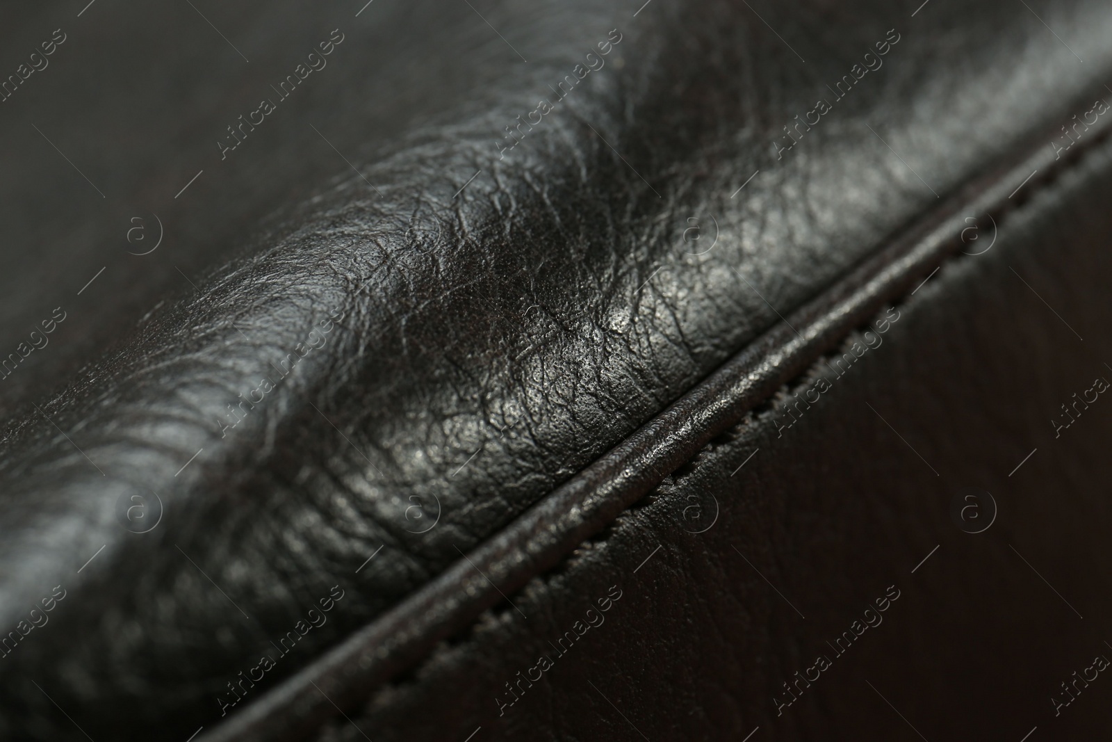 Photo of Texture of black leather as background, closeup