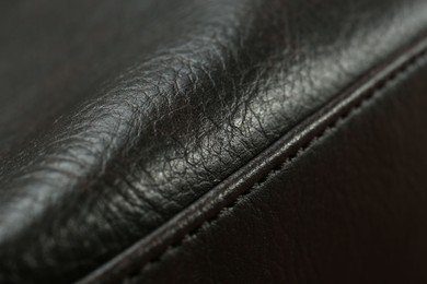 Photo of Texture of black leather as background, closeup