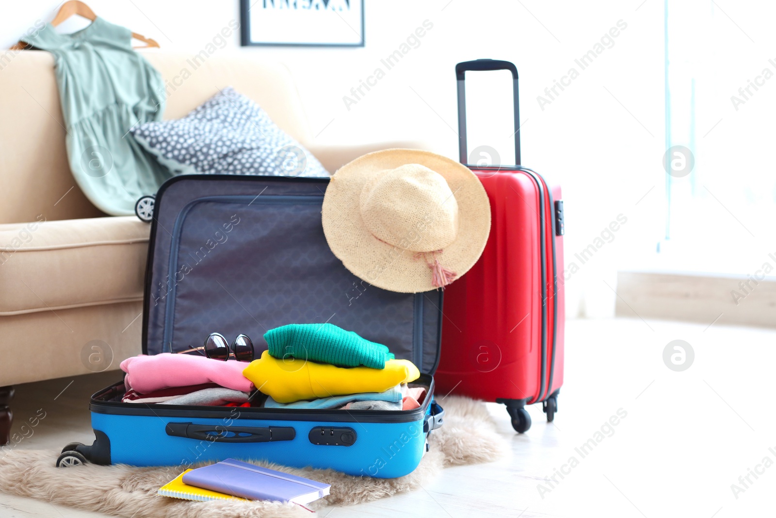 Photo of Packed travel suitcases indoors