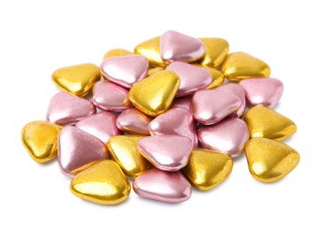 Many delicious heart shaped candies on white background