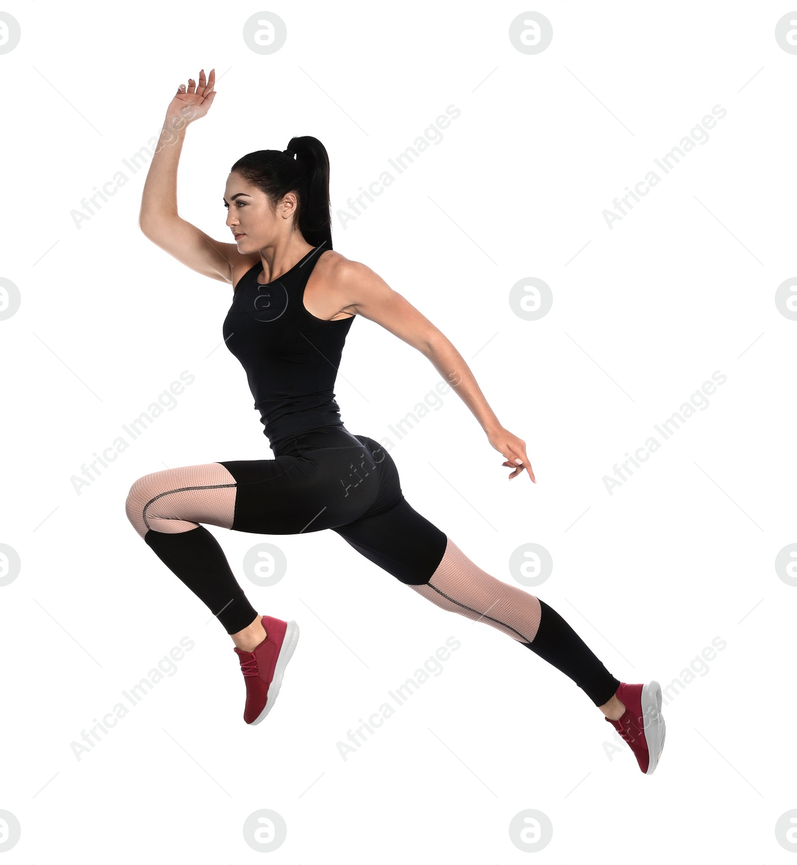 Photo of Sporty young woman running on white background