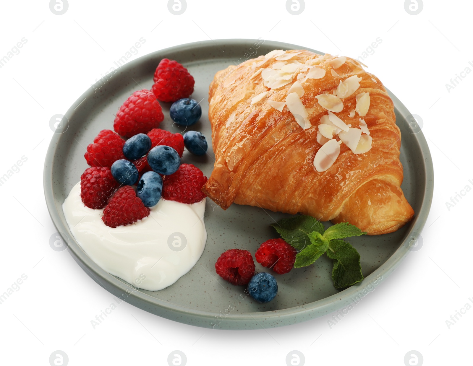 Photo of Delicious croissant, berries and cream cheese isolated on white