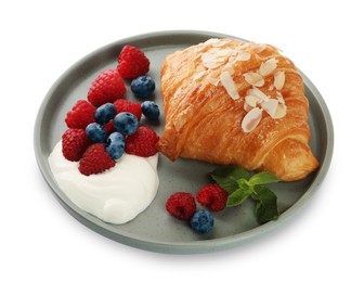 Photo of Delicious croissant, berries and cream cheese isolated on white