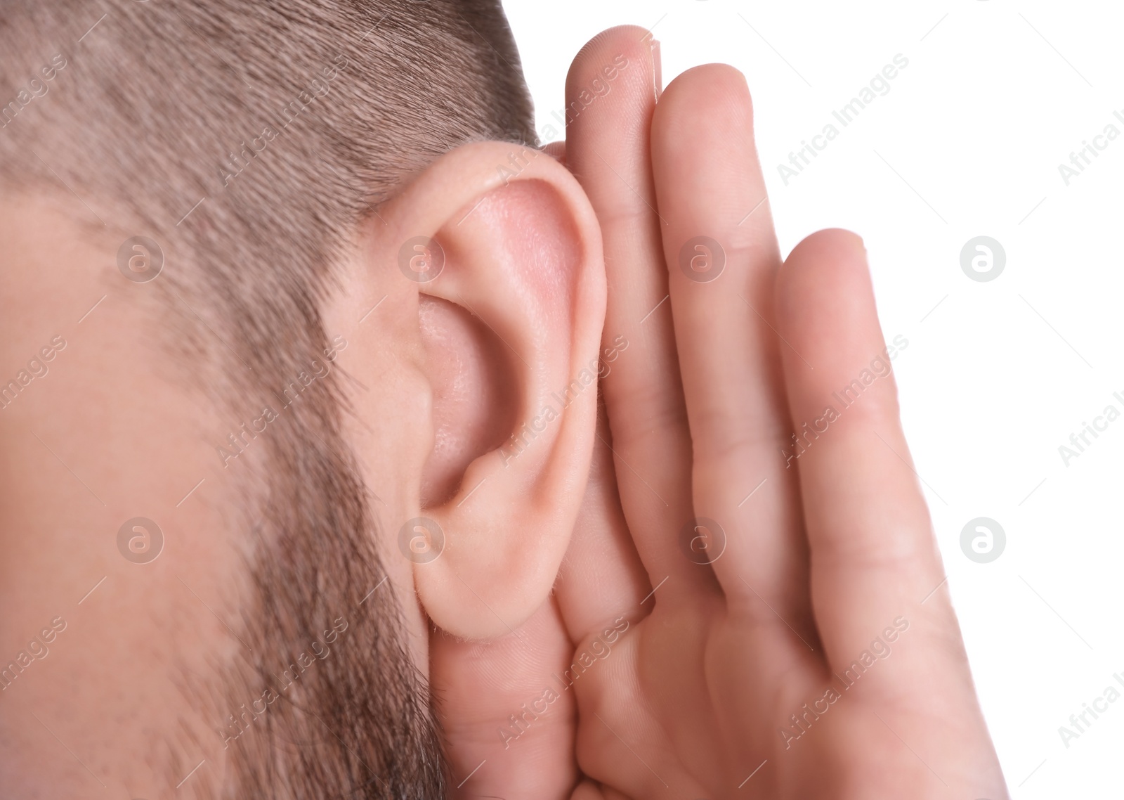 Photo of Young man with hearing problem on white background, closeup