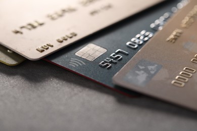 Photo of Plastic credit cards on table, macro view