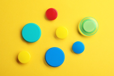 Photo of Bright magnets on color background, top view