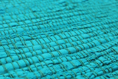 Color woven carpet texture as background, closeup