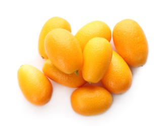 Photo of Fresh ripe kumquats on white background, top view. Exotic fruit