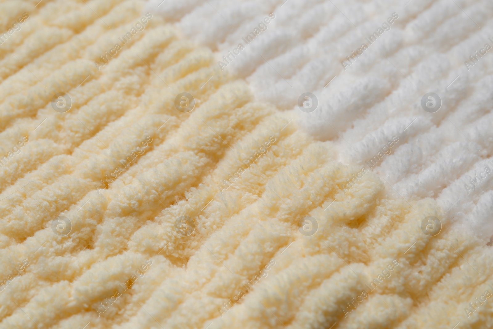 Photo of Texture of soft knitted fabric as background, closeup