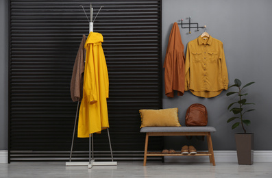 Hallway interior with stylish furniture, clothes and accessories