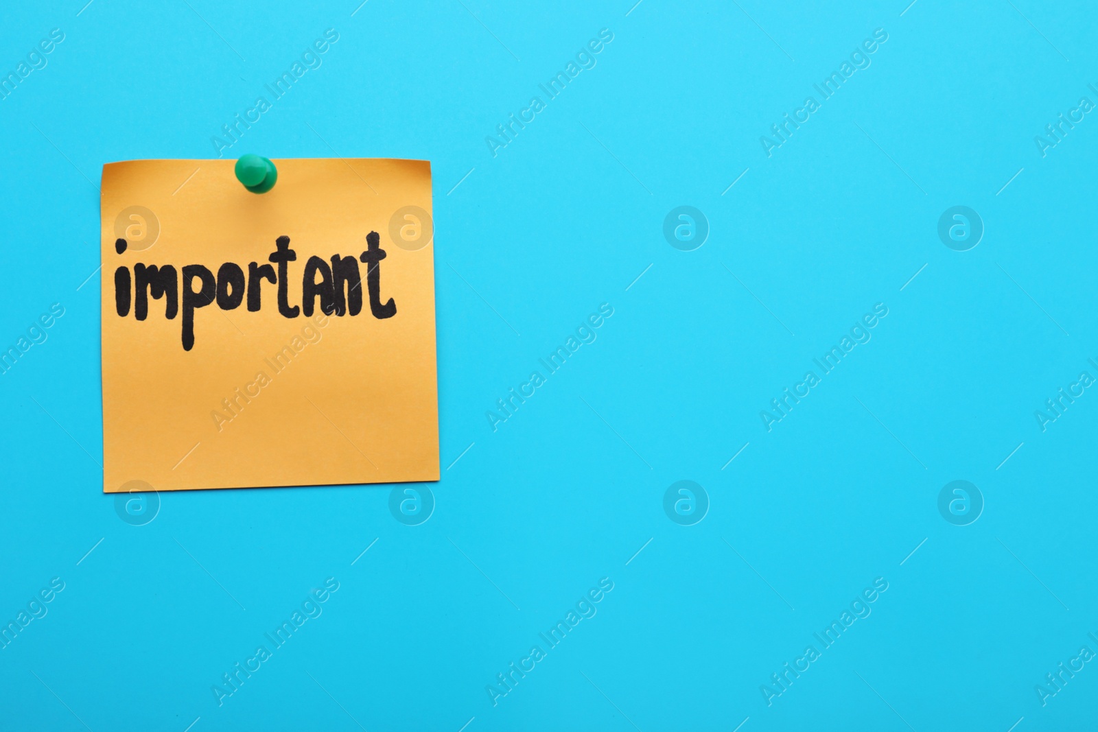 Photo of Paper note with word Important pinned on blue background, space for text