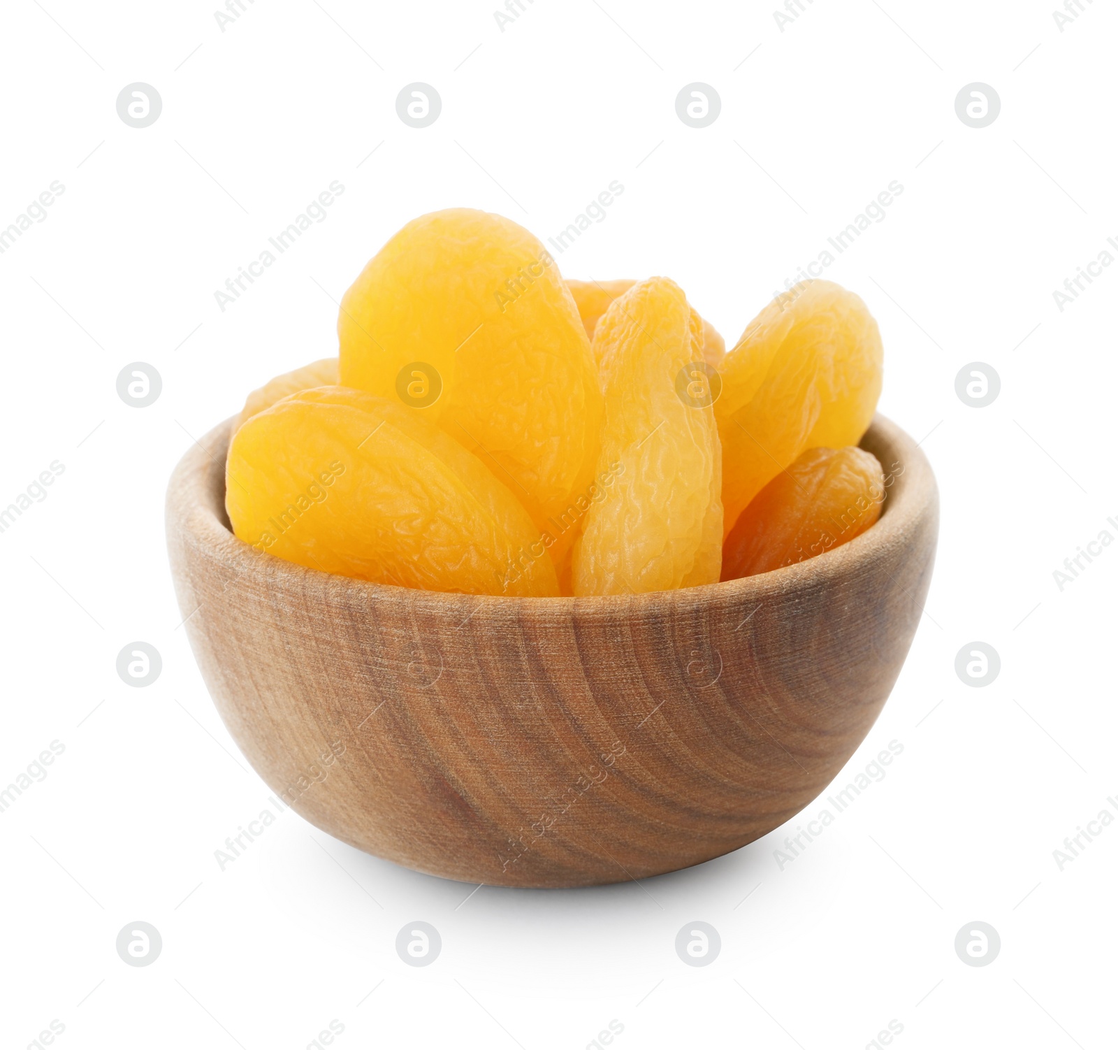 Photo of Wooden bowl with tasty dried apricots isolated on white