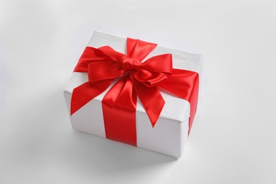 Photo of Beautifully wrapped gift box on white background