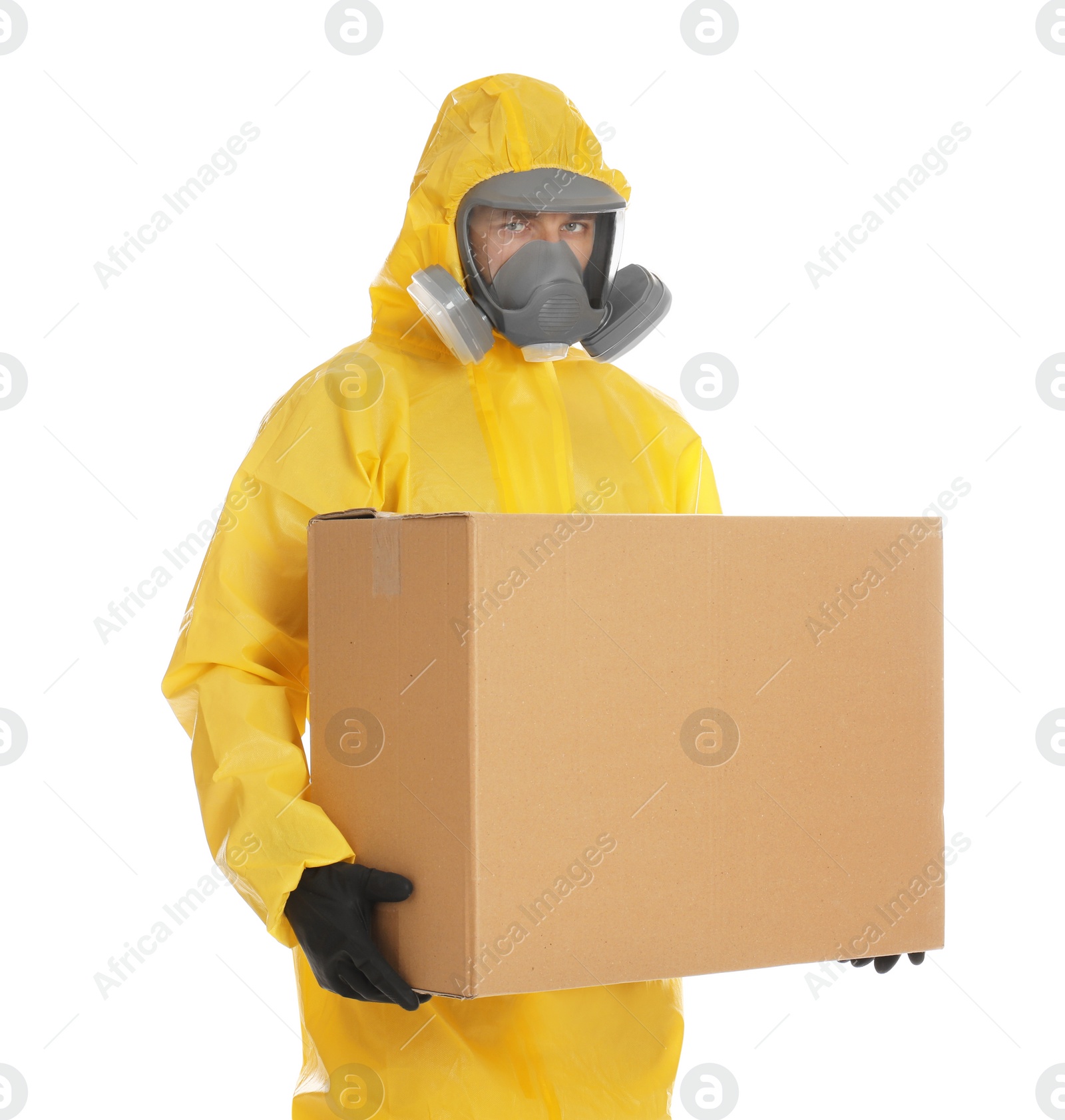 Photo of Man wearing chemical protective suit with cardboard box on white background. Prevention of virus spread