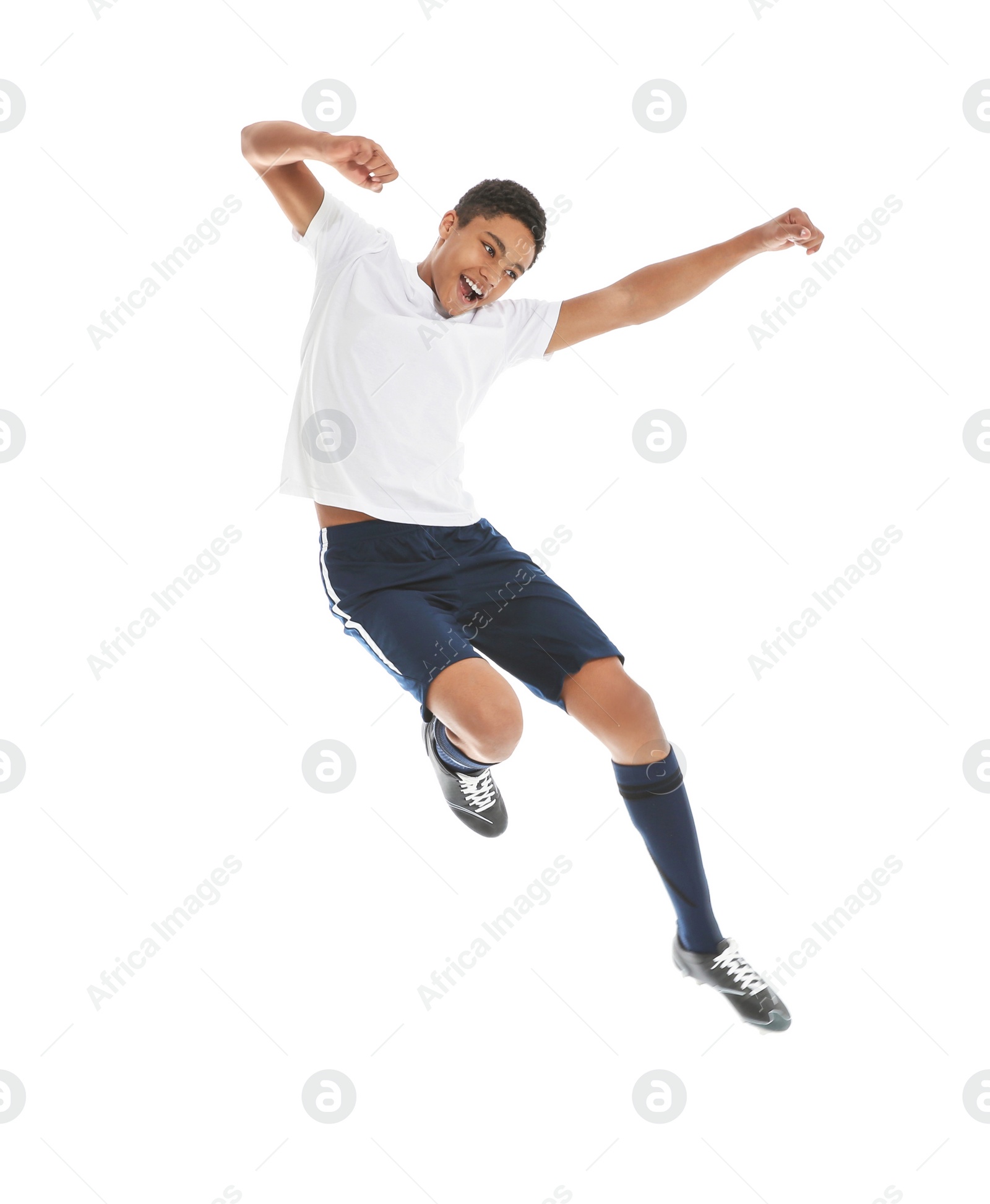 Photo of Teenage African-American boy playing football on white background