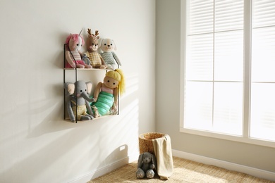 Photo of Many cute toys indoors. Baby room interior elements