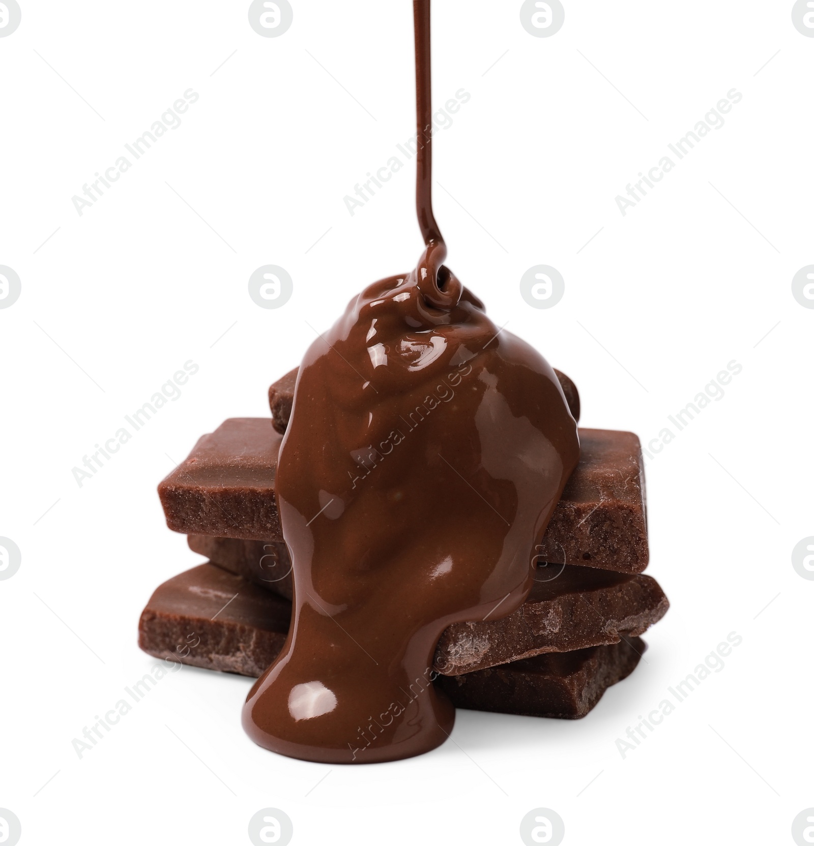 Photo of Pouring tasty milk chocolate paste onto pieces isolated on white