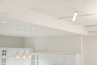White ceiling with modern lighting in room