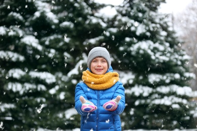 Photo of Portrait of little boy outdoors on snowy day