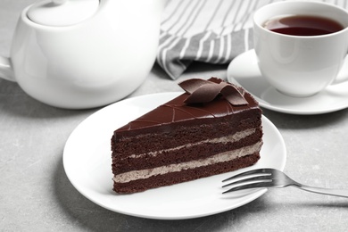 Delicious fresh chocolate cake served on light grey table