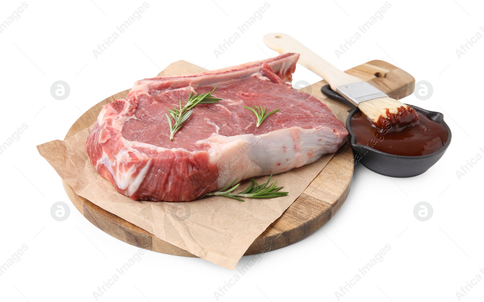 Photo of Board with raw meat, rosemary and marinade isolated on white
