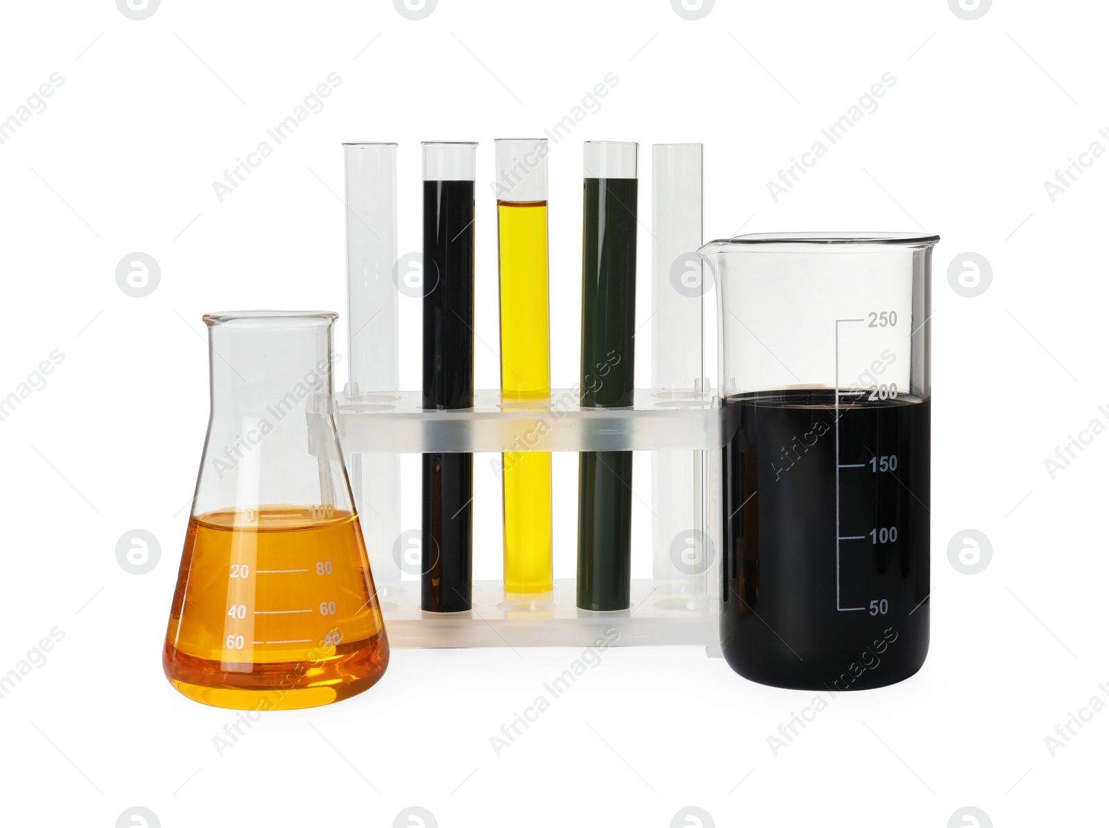 Photo of Laboratory glassware with different types of crude oil isolated on white