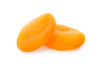 Photo of Two tasty apricots on white background. Dried fruits