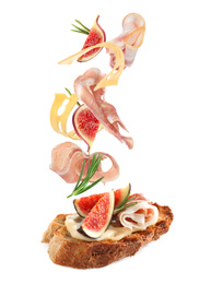 Image of Tasty bruschetta with flying ingredients on white background