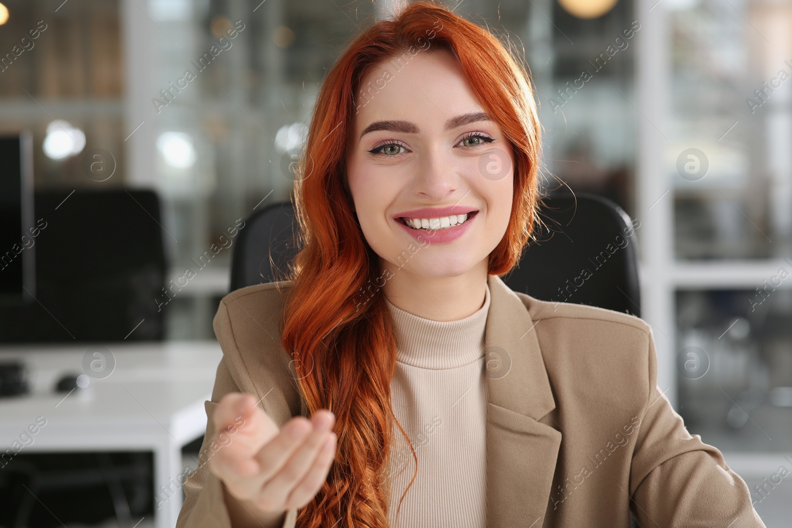 Photo of Happy woman having video call in office, view from web camera