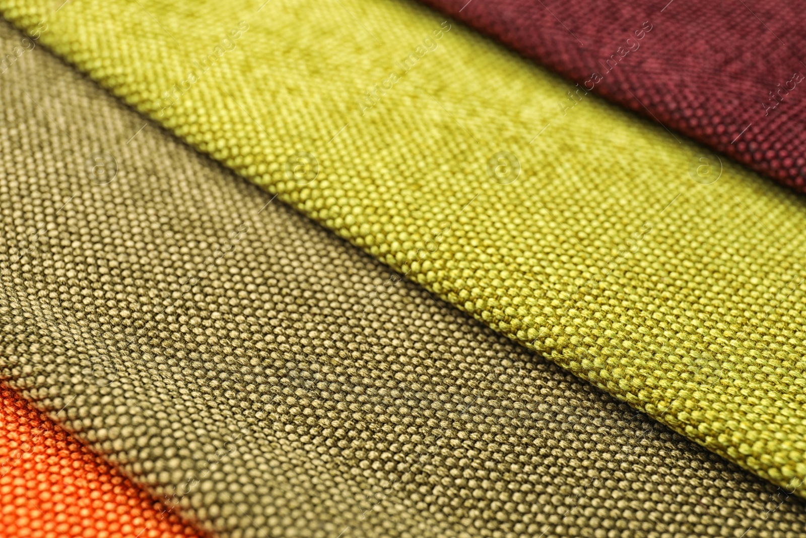 Photo of Fabric samples of different colors for interior design as background