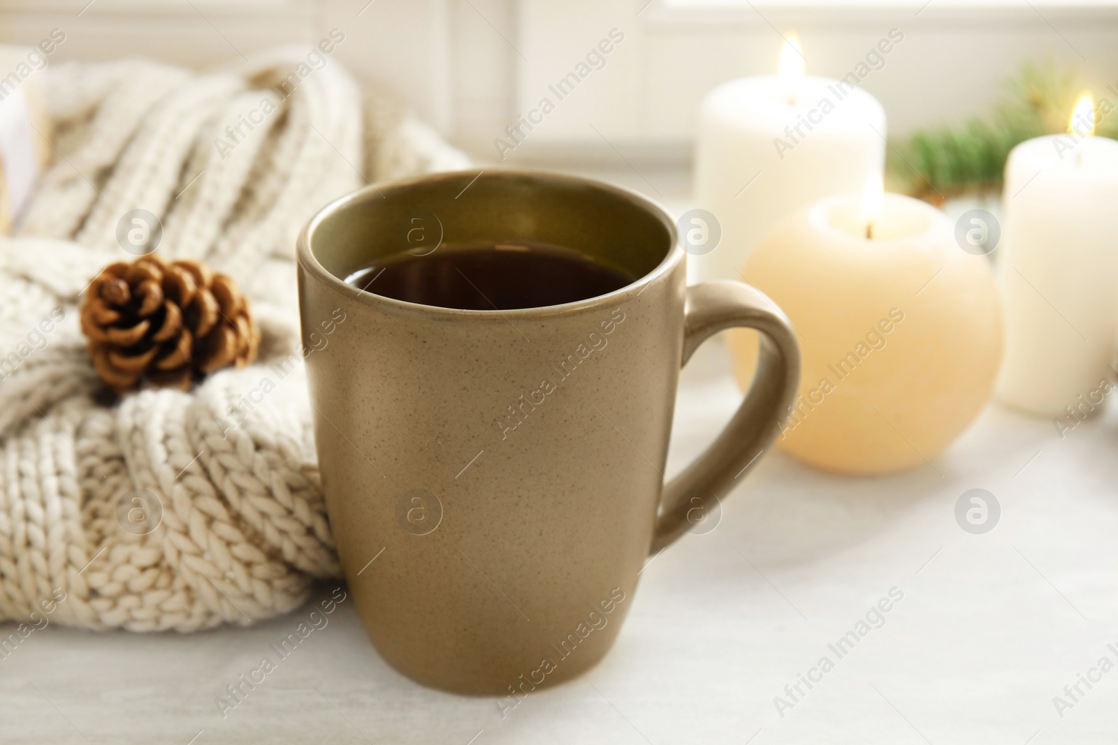 Photo of Composition with cup of hot winter drink on table. Cozy season