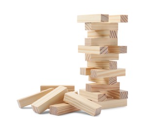 Photo of Jenga tower and pile of wooden blocks on white background