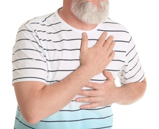 Mature man having heart attack on white background