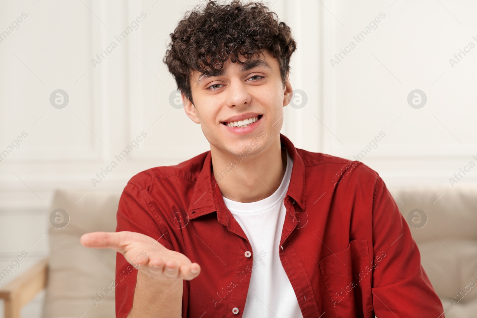 Photo of Young man having online video call at home, view from web camera