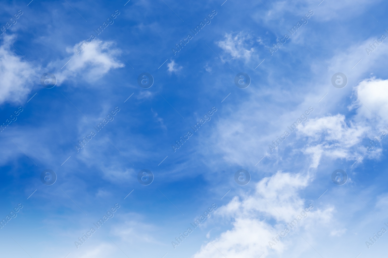 Photo of Picturesque blue sky with white clouds on sunny day