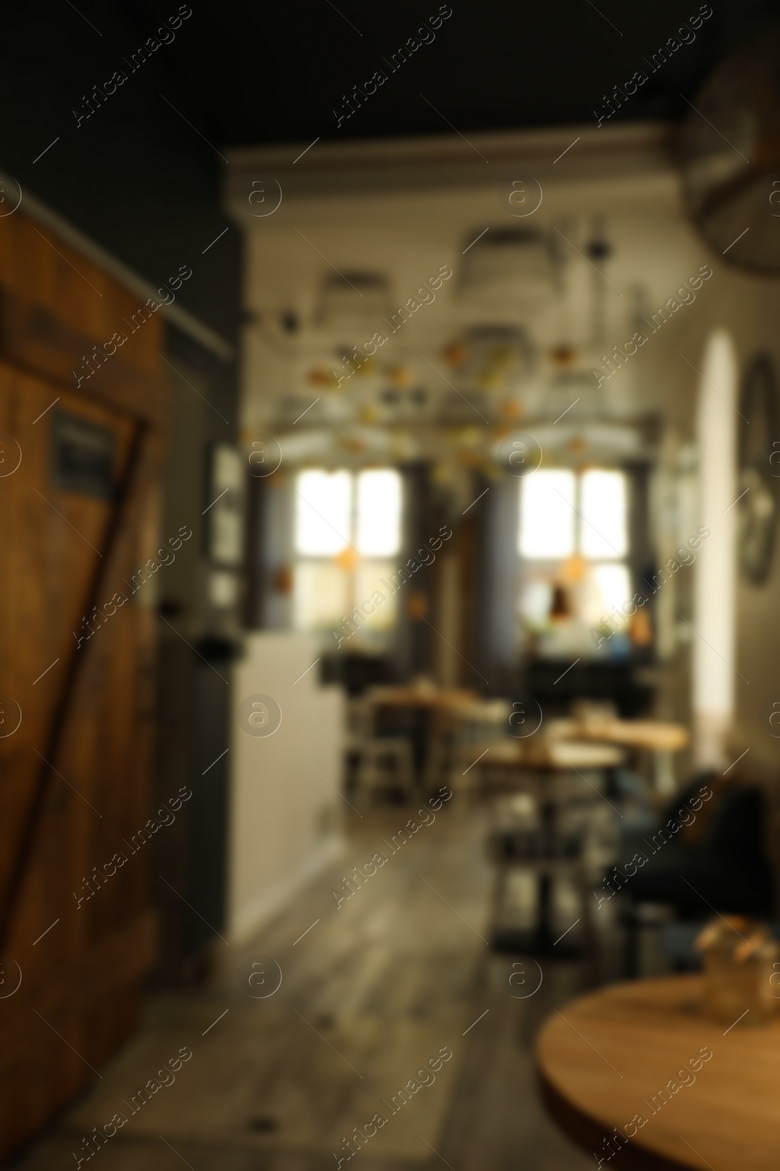 Photo of Stylish cafe interior with furniture, blurred view