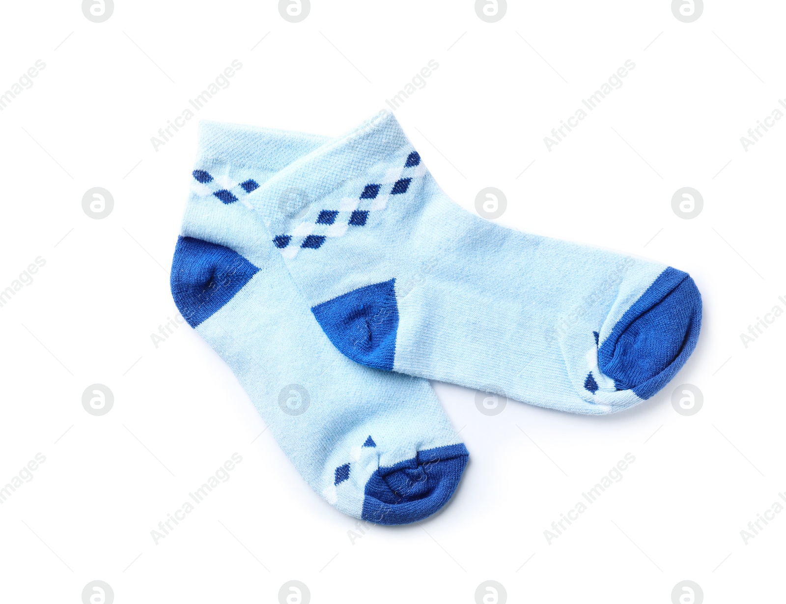 Photo of Cute child socks on white background, top view