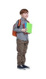 Little schoolboy with backpack and books on white background