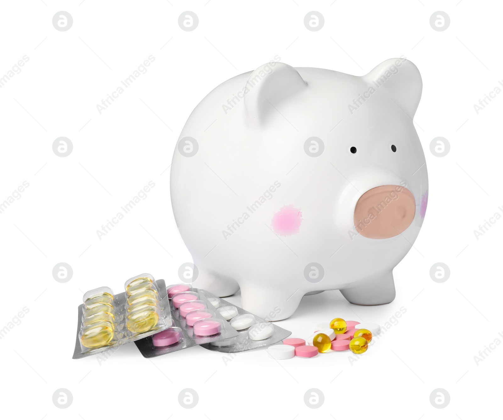 Photo of Piggy bank and pills on white background. Medical insurance