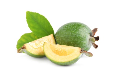 Photo of Cut and whole feijoas with leaves on white background