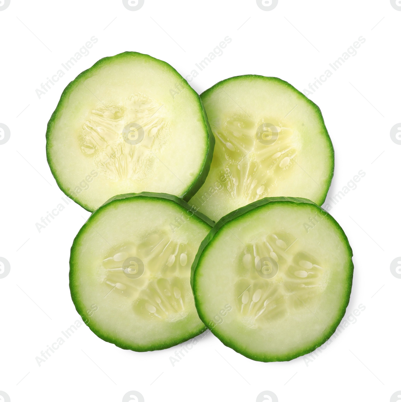 Photo of Slices of fresh cucumber isolated on white, above view