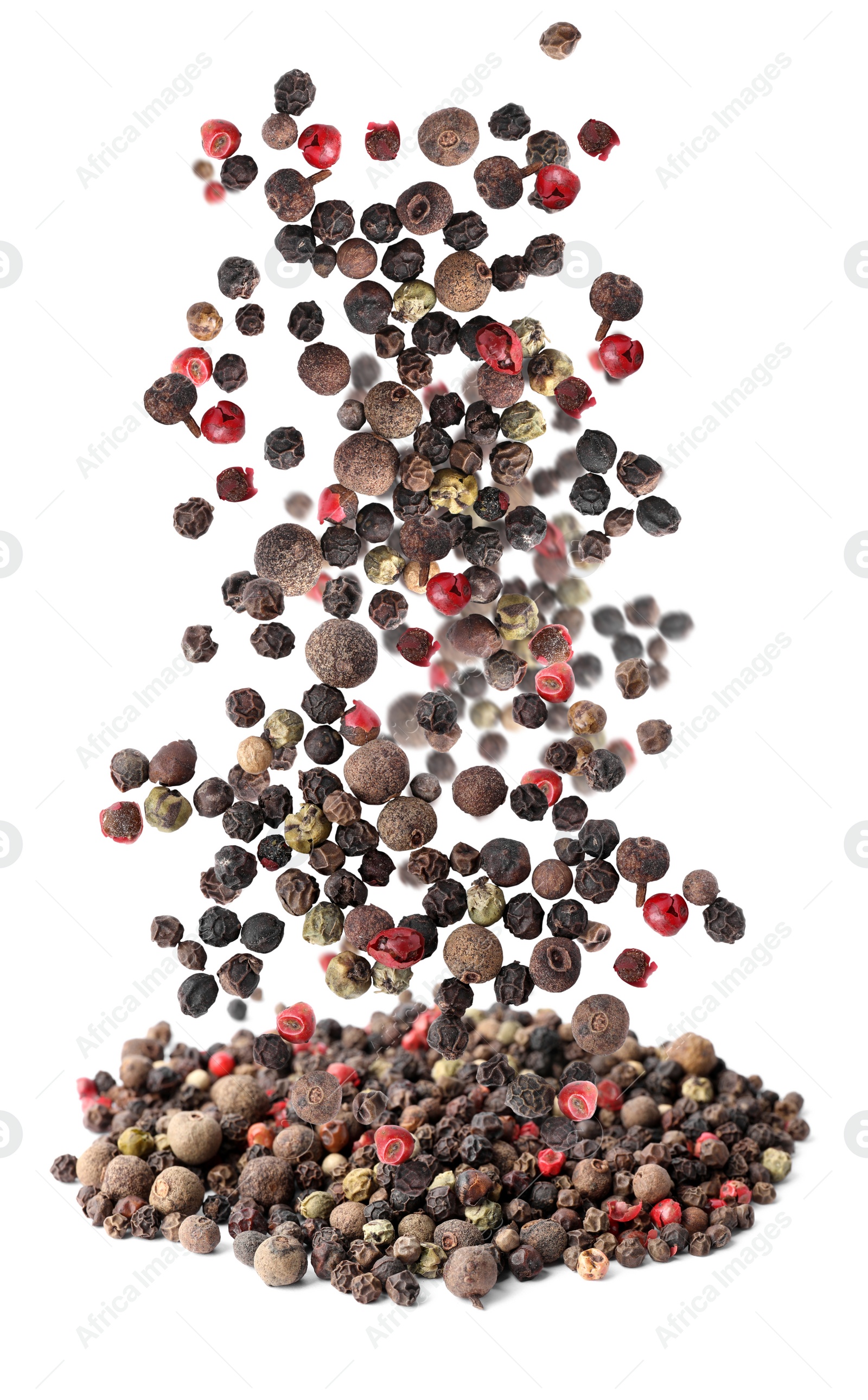 Image of Different peppercorns falling into pile on white background