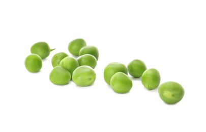 Fresh raw green peas on white background