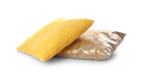 Different colorful pillows on white background