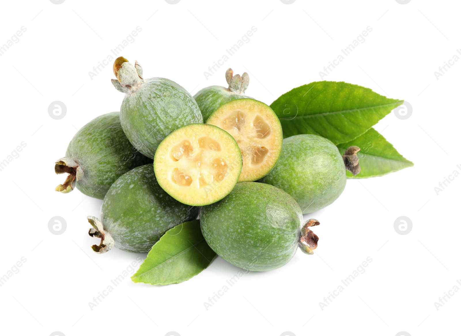 Photo of Cut and whole feijoas with leaves on white background