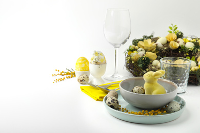 Festive Easter table setting with beautiful floral decor. Space for text